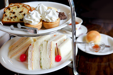 English Afternoon Tea with sandwiches, pastries, cakes and tea /...