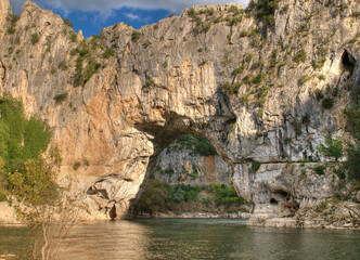 Pont D'Arc In The Canyon Of The Gorges De L'Ardeche With Reflections On The River Ardeche In France...