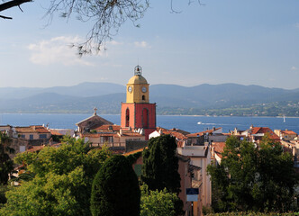 Clock Tower In The Old Town Of Saint Tropez With The Bay In The Background In Preovence France On A...