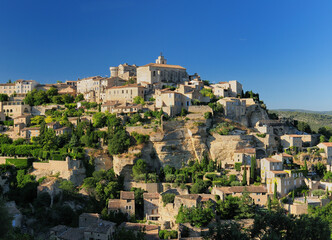 Historic Mountain Village Gordes In Provence France On A Beautiful Summer Day With A Clear Blue Sky