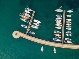 Fototapeta na wymiar Yachts and Boats Moored in Pier Harbor on Adriatic Coast in Istra, Koper, Slovenia