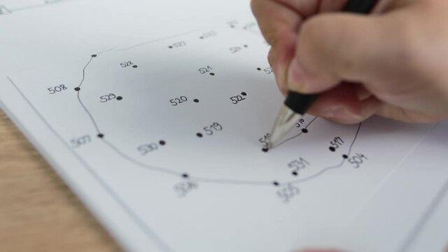 close-up female hand draws lines on paper, connects dots by numbers, concept of brain development in old age, preventive measures in the fight against senile dementia, therapeutic health support