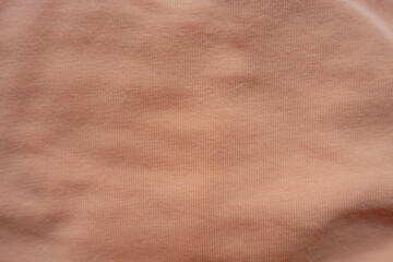 apricot colored simple cotton jersey fabric from above