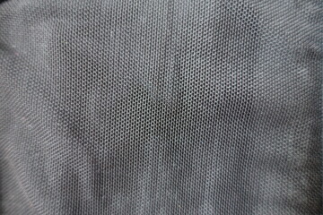 View of simple thin black mesh fabric from above