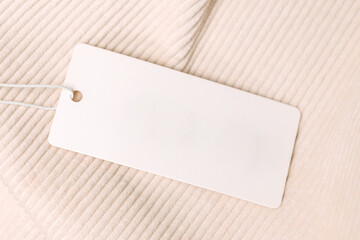 Label and Tag on beige velveteen fabric. mockup for design close up