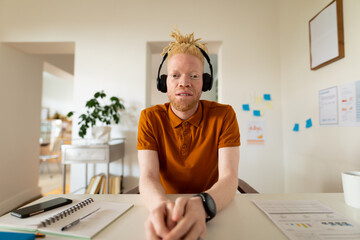 Albino african american man working from home making video call - Powered by Adobe