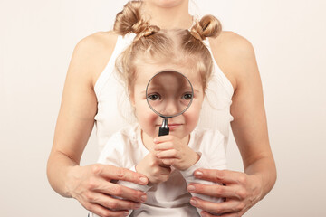 Beautiful little girl with mother, the light background