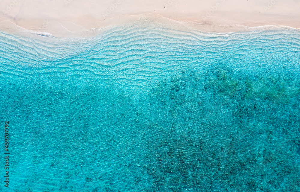 Wall mural beach and ocean as a background from top view. azure water background from top view. summer seascape
