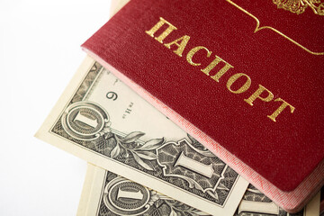 A foreign passport and dollars on a white isolated background.