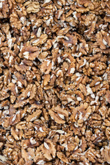 Peeled walnut kernels sit on the store counter and create an abstract texture.