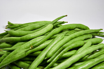 Fresh green beans on white background isolated.