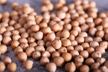 raw chickpeas are lying on a gray table