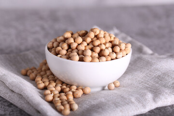 raw chickpeas are lying on a gray table
