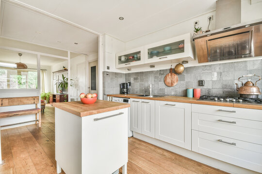 Modern kitchen with white furniture and appliances