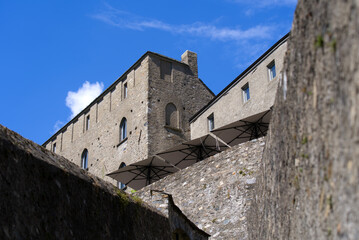 Fototapeta na wymiar Unesco world heritage castle Castelgrande at City of Bellinzona, Canton Ticino, on a sunny late summer morning. Photo taken September 11th, 2021, Bellinzona, Switzerland.