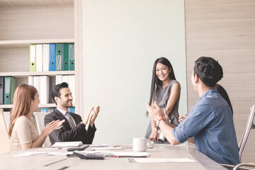 Business woman and team having meeting at meeting room in office.