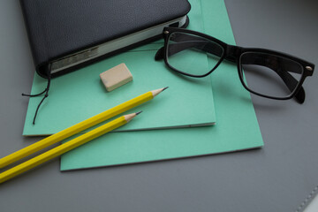 Pencil, diary, notebooks and glasses on the table. Teachers day concept. Back to school.