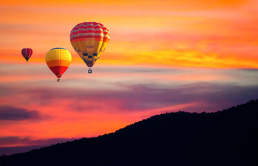 Landscape with hot air balloons flying over mountain valley in sunset ,sunrise sky. Adventures,...