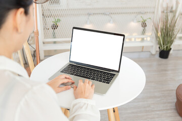 Fototapeta premium computer screen blank mockup.hand woman work using laptop with white background for advertising,contact business search information on desk at coffee shop.marketing and creative design