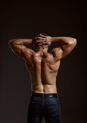 Fototapeta na wymiar Male athlete with muscular body, back view