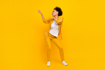 Fototapeta na wymiar Full length body size photo woman dancing at party isolated bright yellow color background