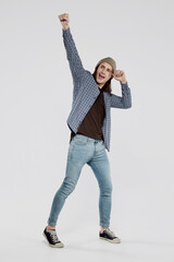 Young man in winner pose gesticulating with fist