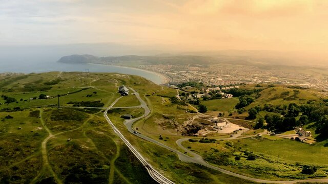 Aerial view of Llandudno in the distance from the top of great orme summit cable car station