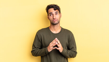 hispanic handsome man scheming and conspiring