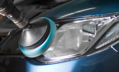 Polishing the headlights on the car. Close up © Dima Plotnikov