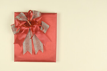 Gift box on orange space. Present for birthday, valentine day, Christmas, New Year concept. copy space.