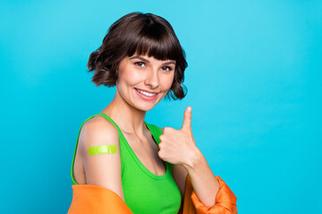 Photo of young bob brown haired woman make thumb up wear blazer top vaccine smile isolated on blue...