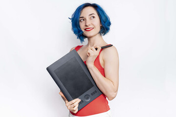 A female designer in red bodysuit holding graphic tablet