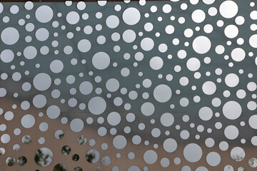 Metal surface with perforations for background