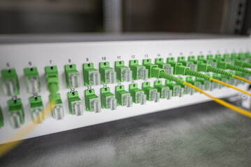 Gigabit passive optical networks equipment pptical distribution panel with optic patch cord cables close-up