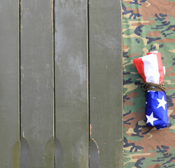USA flag on military wooden background