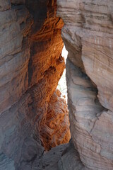Rock window through the massive red sandstone rock formation Altschloßfelsen near the German-French border, Eppenbrunn, Pfalz, Germany