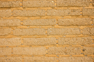 Detail of old adobe brick wall for background or texture. Mud brick background to add your text....