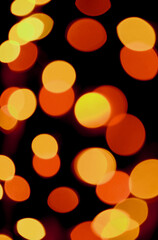 Abstract Blurred Vibrant Yellow and Orange Color Illuminated Light on Dark Background