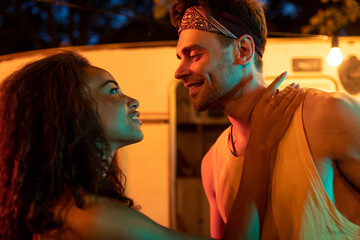 Young couple on vacation with the camper