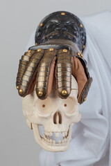 Medieval knightly brown plate gauntlet from Italian armor, in the form of a lion's face and mane,...