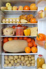 Refrigerator, content. Color diet. Organic orange food. Yellow nutrition in fridge, refrigerator. Healthy, dietary nutrition. Yellow vegetables, fruits, berries. Diet products, eating. Orange color
