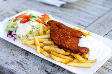 Schnitzel with french fries and salad