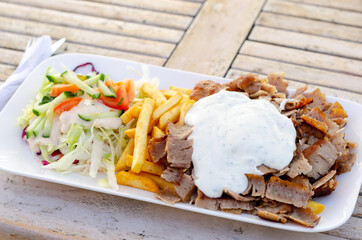 Doner meat with french fries and salad