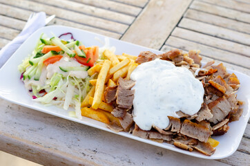 Doner meat with french fries and salad