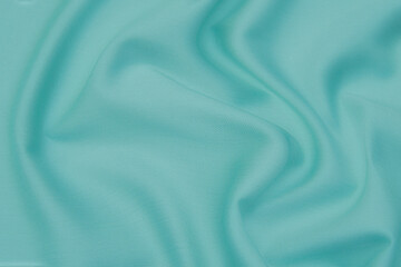 Texture, background, pattern. Texture of tidewater blue or tranquil silk fabric. Beautiful...
