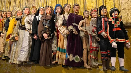 Poster Puppets hanging in Sicilian marionette theater opera in Palermo, Sicily © bleung