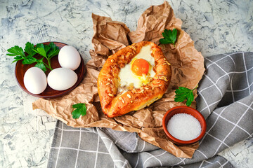 khachapuri Adjara traditional Georgian cuisine meal. Baked bread with cheese and egg filling. National pastry snack