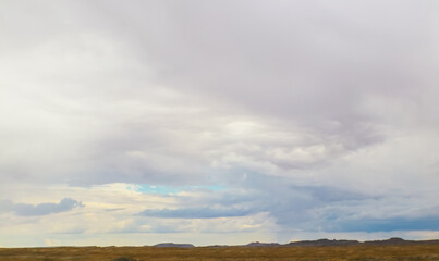 Northern Utah USA landscape with mountaind in distance under bug overcast beautiful sky.