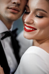 Portrait of a couple. Young and attractive woman and man. Red lips