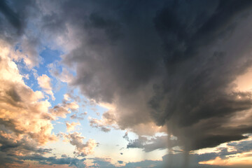 Fototapeta premium Landscape of dark clouds forming on stormy sky during thunderstorm.